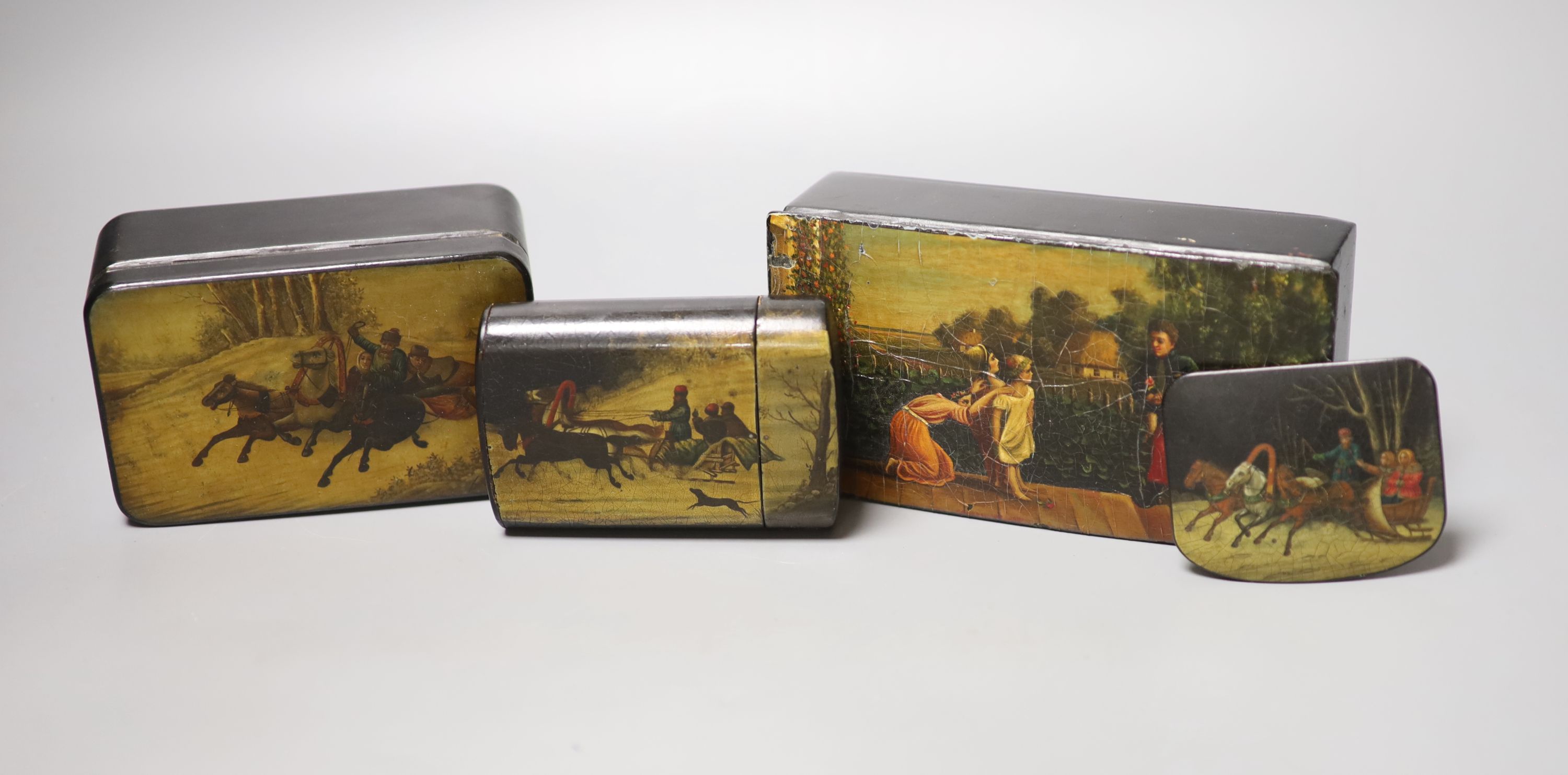 Two Russian papier mache boxes painted with troika and two related items, largest 17 x 5cm